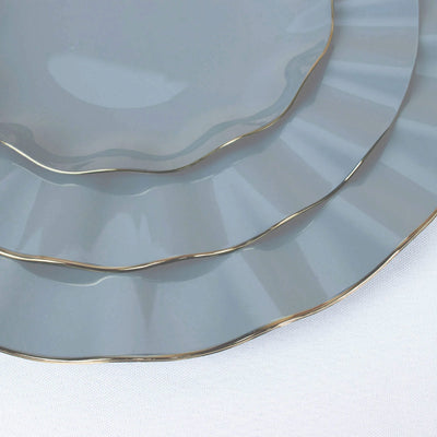 Gray plates with gold trim in a stacked arrangement.