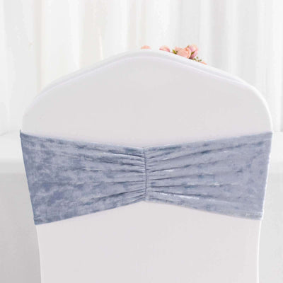 Gray velvet chair cover with gathered design, perfect for events or weddings.