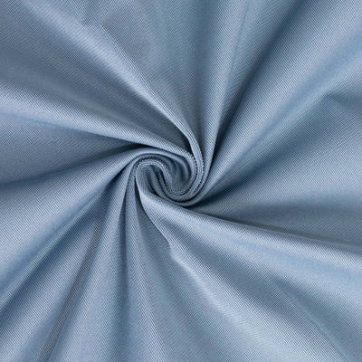 Light blue textured fabric in a circular swirl pattern.