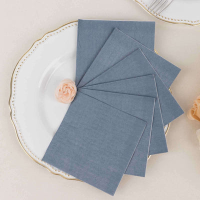 Set of blue envelopes on a decorative plate with a rose.