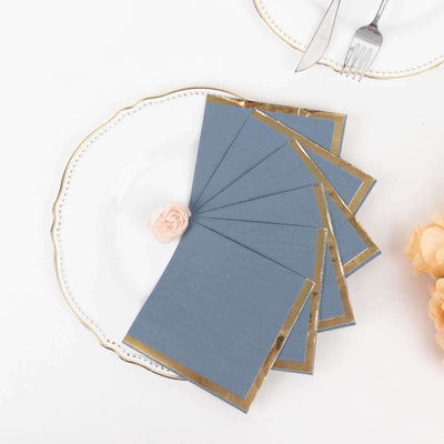 Blue greeting cards with gold trim on an elegant plate
