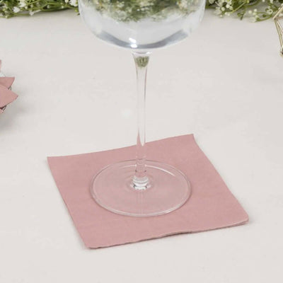 Pink napkin under a glass, perfect for table settings and events.