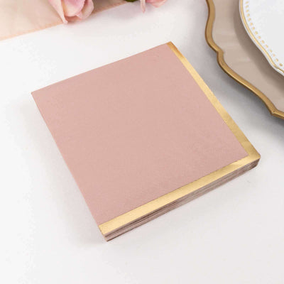 Pink square notepad with a gold edge on a white background