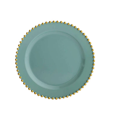 Turquoise plate with gold beaded rim on a plain background
