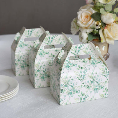 Floral takeout boxes on a table with a vase of roses.