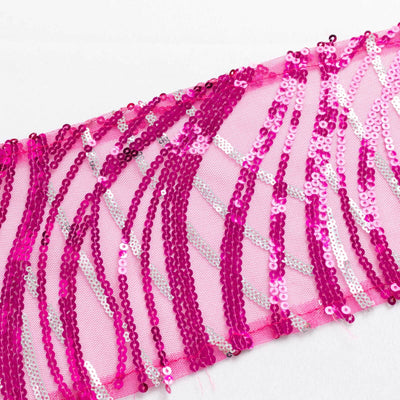 Pink sequin fabric with shimmering patterns on a white background