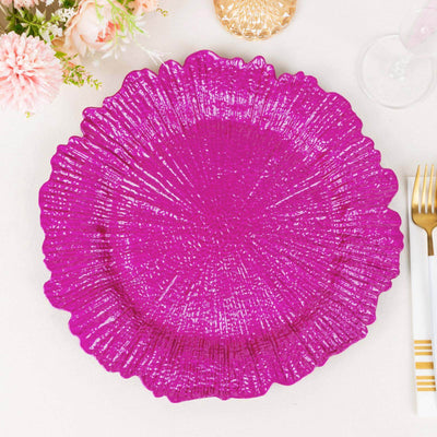 Bright pink decorative plate with textured design on a white background.