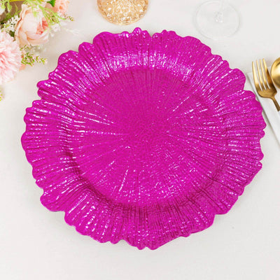 Shiny fuchsia decorative plate with a textured floral design.