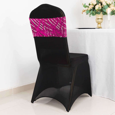 Black chair with colorful fabric backrest, positioned by a table.