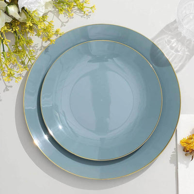 Set of two elegant blue plates with gold rims on a white background.