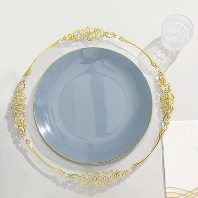 Elegant blue plate with ornate gold trim on a white backdrop.