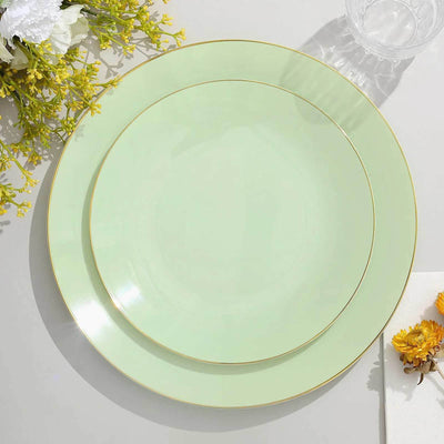 Green plates with gold trim on a white background.