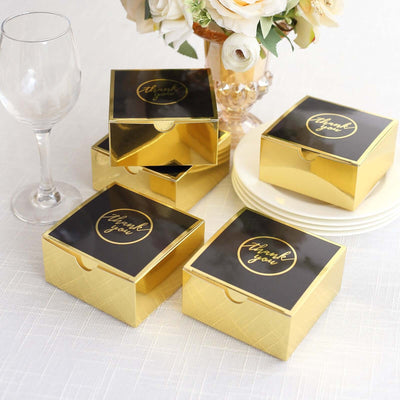 Gold gift boxes with black "Thank you" labels, arranged elegantly.