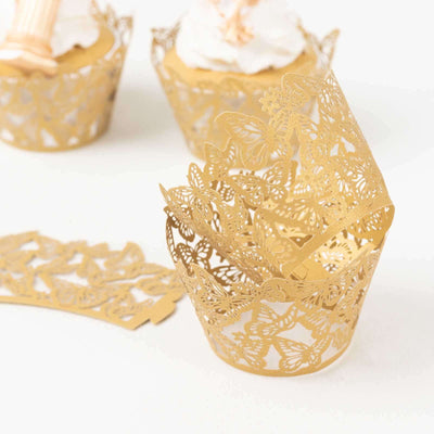 Gold butterfly cupcake wrappers for elegant dessert presentation.