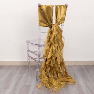 Gold satin chair sash with cascading ribbons.