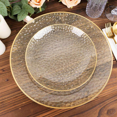 Elegant textured glass plates with gold trim for stylish dining.