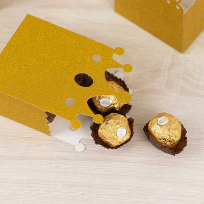 Gold glitter gift box with Ferrero Rocher chocolates inside.
