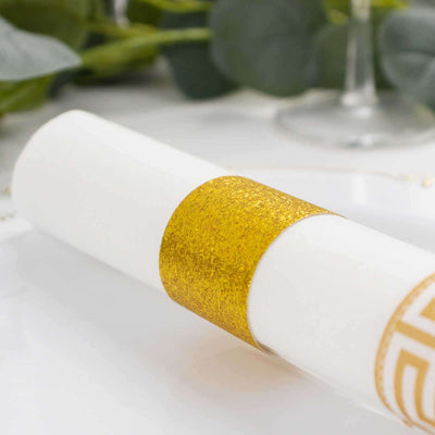 White rolled paper with a gold band, elegantly styled for celebrations.