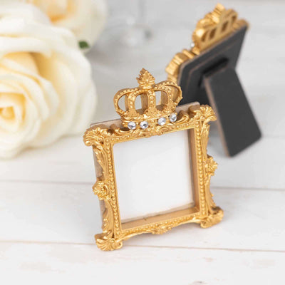 Gold crown decorative picture frame with ornate design.