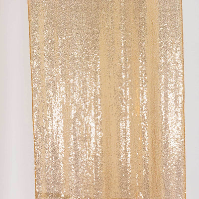 Gold sequin fabric with a shimmering texture, perfect for festive decor.