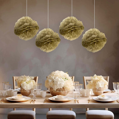 Elegant paper lanterns hanging above a beautifully set dining table.