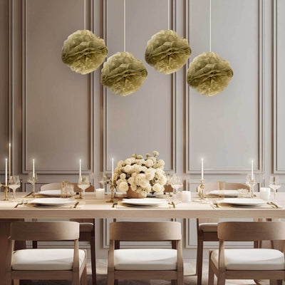 Elegant dining room with soft green paper lanterns and a floral centerpiece.