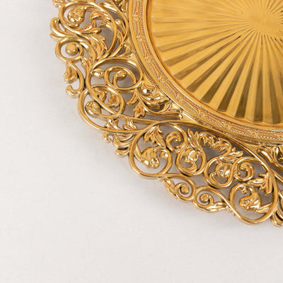 Ornate gold decorative plate with intricate floral design