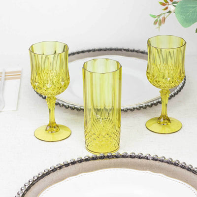 Yellow glassware set on a dining table with elegant plates.
