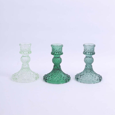 Set of three vintage glass candle holders in green and clear hues