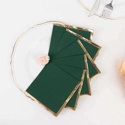 Green and gold bordered greeting cards on a decorative plate.