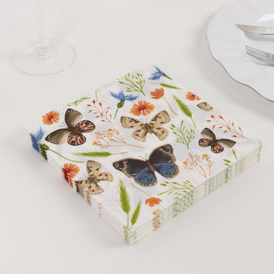 Decorative napkins with butterfly and floral design on a white background.