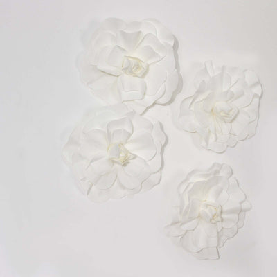 White decorative flowers on a plain background
