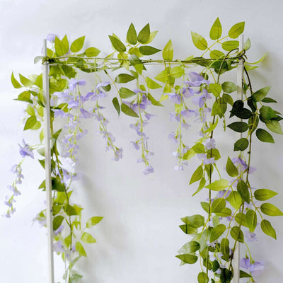 Artificial hanging vine with purple flowers and green leaves