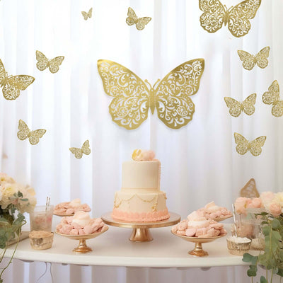 Elegant butterfly-themed cake display with pink and gold decor for a celebration.