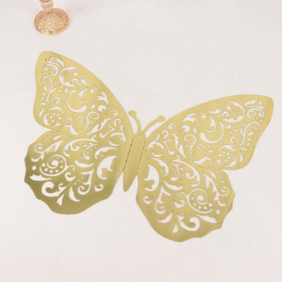 Gold decorative butterfly cutout with intricate patterns on a white background.