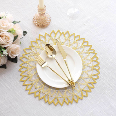 Elegant gold cutlery set on decorative lace placemat with white plate.