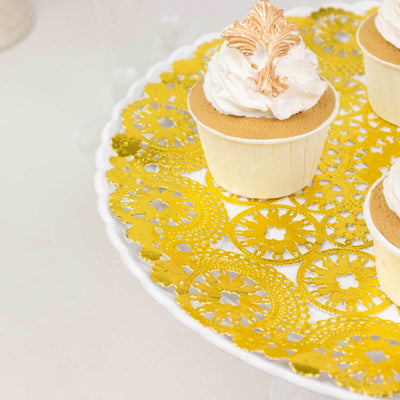 Cupcakes with frosting on a decorative yellow lace platter.