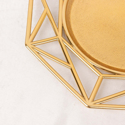 Geometric gold tray with textured base and angular design.