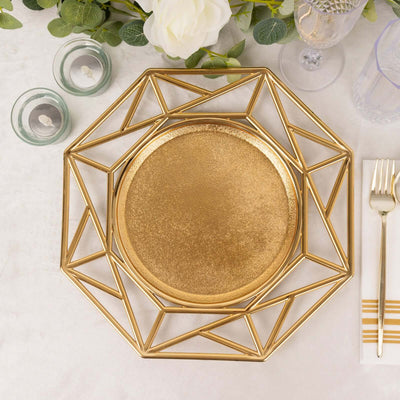 Gold geometric charger plate on a table setting with decorative elements.