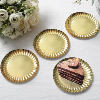 Gold paper plates set with a cake slice, perfect for parties and celebrations.