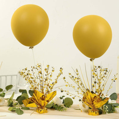 Yellow balloons with gold starburst decorations for festive celebrations.