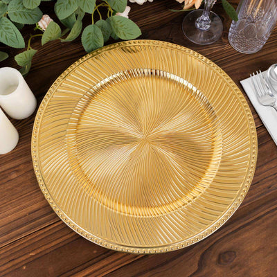 Gold decorative charger plate with textured design on wooden table.