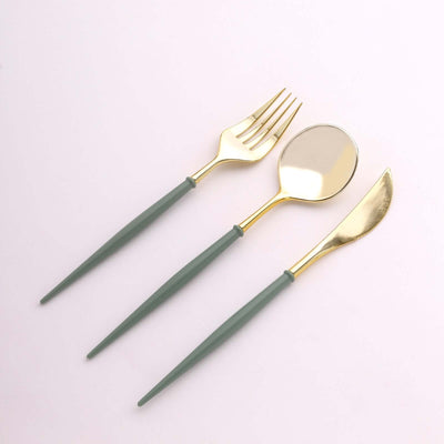 Gold utensils with green handles: fork, spoon, and knife.
