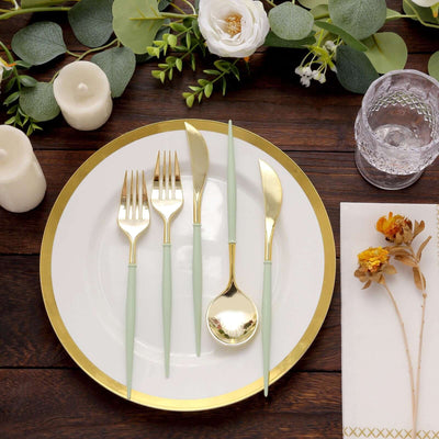 Elegant gold and mint green cutlery set on a table with floral decor.