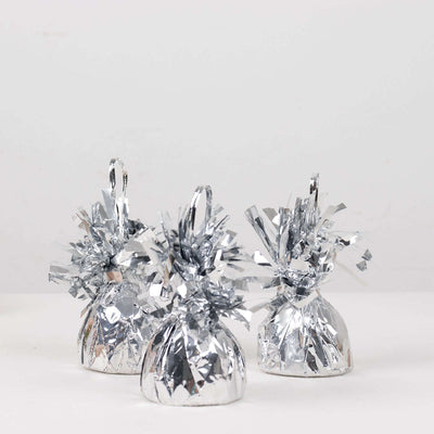 Silver party decorations in a studio isolation shot.
