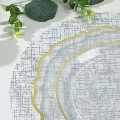 Elegant clear plate with gold rim on textured silver charger.
