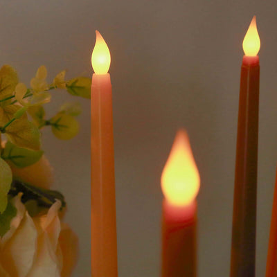 LED flickering candles in various colors with soft glow.