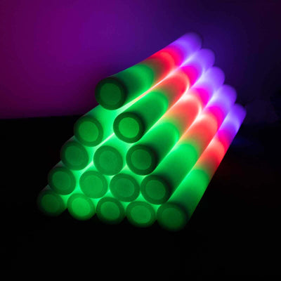 Colorful glowing sticks arranged in a pyramid formation.
