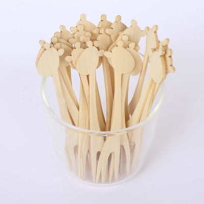 Bamboo appetizer forks with animal-shaped tops in a clear container