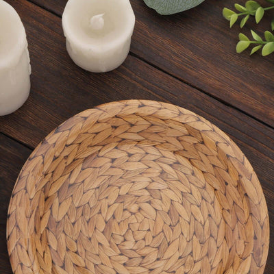 Woven decorative bowl with a natural texture on a wooden surface.